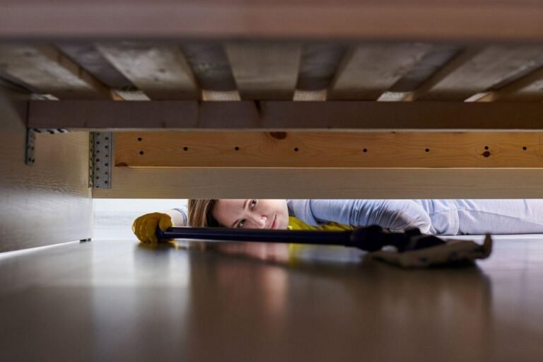 Cleaning under the cot